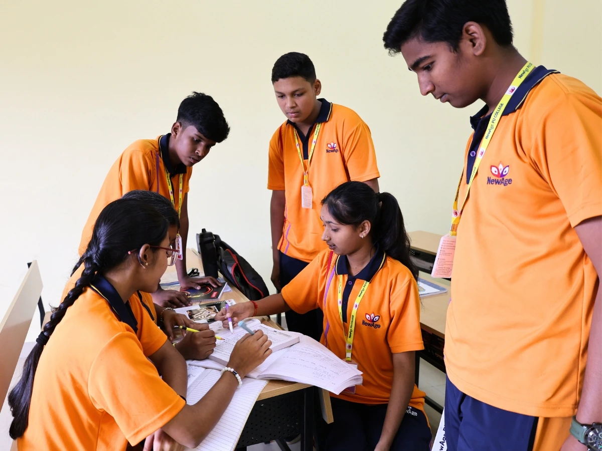 Students studying in a science classroom at NewAge PU College Yelahanka