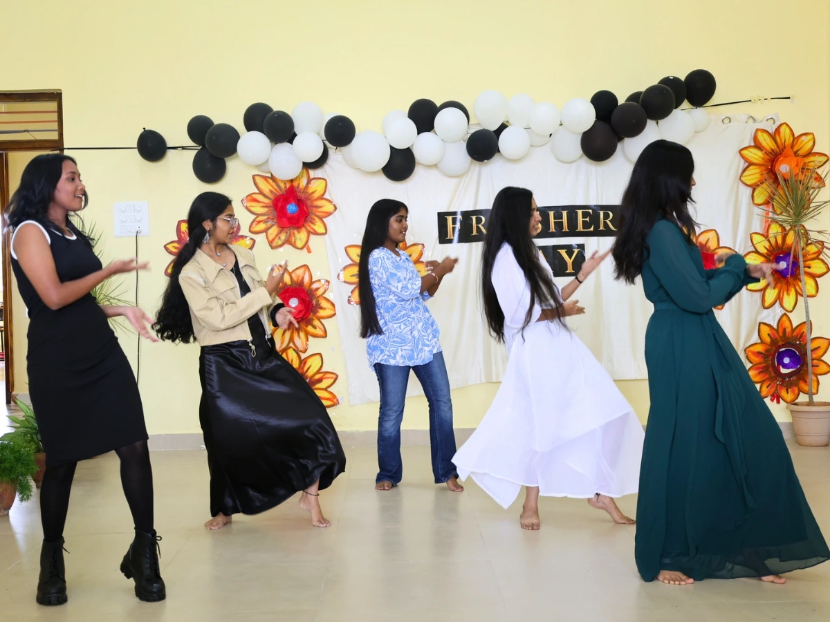 Students performing in a cultural event on stage at NewAge PU College