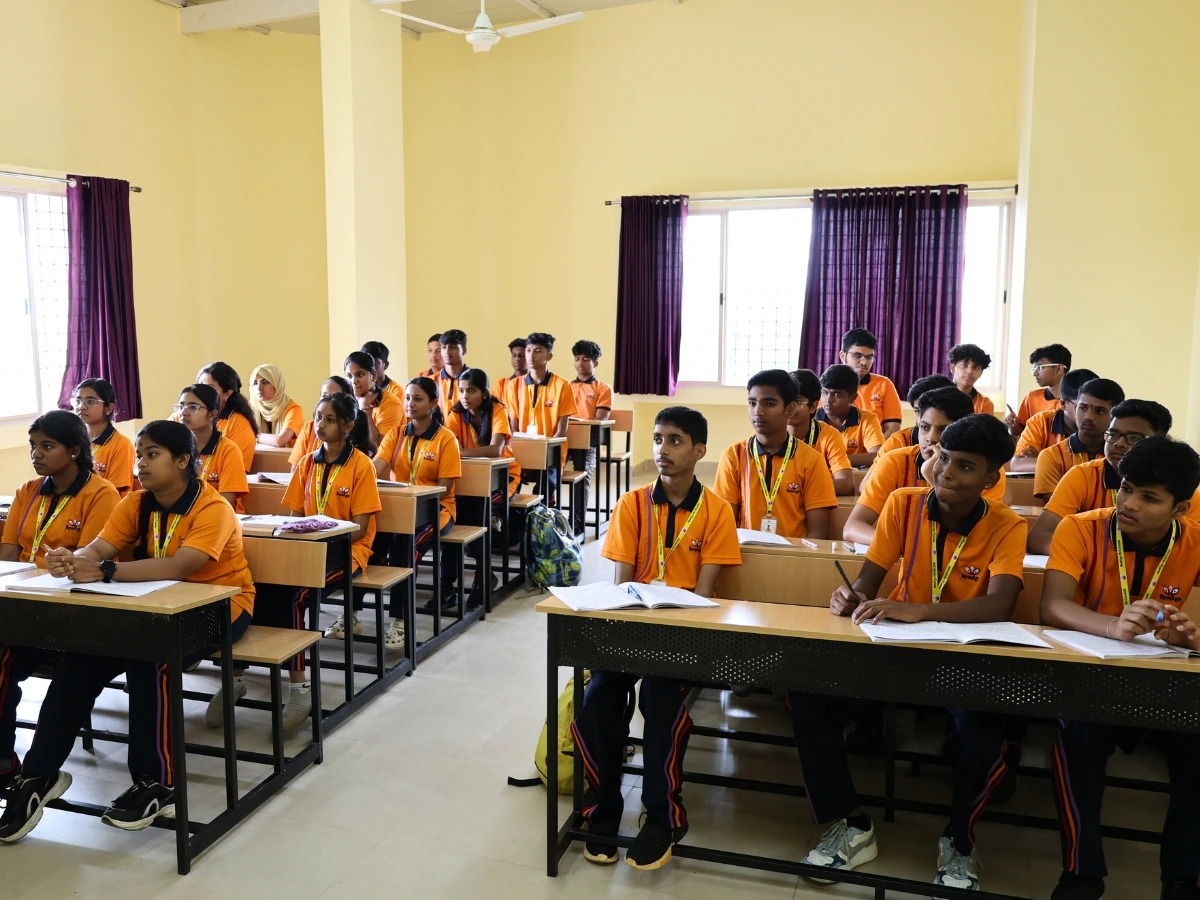 Students engaged in an interactive classroom session at NewAge PU College Yelahanka