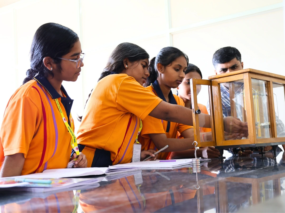Students engaged in lively discussion in a NewAge PU College lecture hall